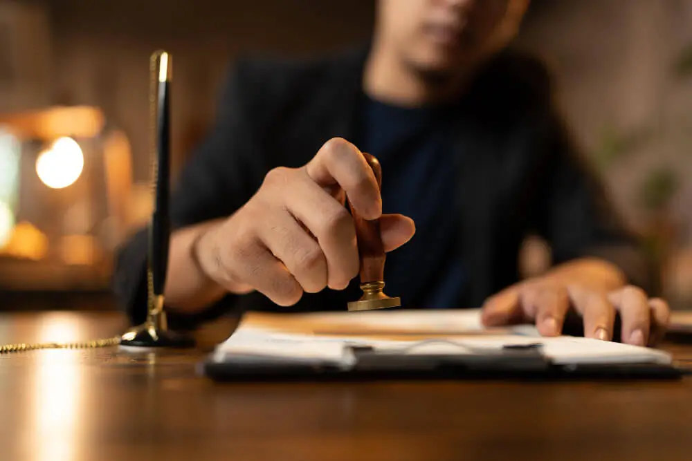 Sworn translator stamping an official document